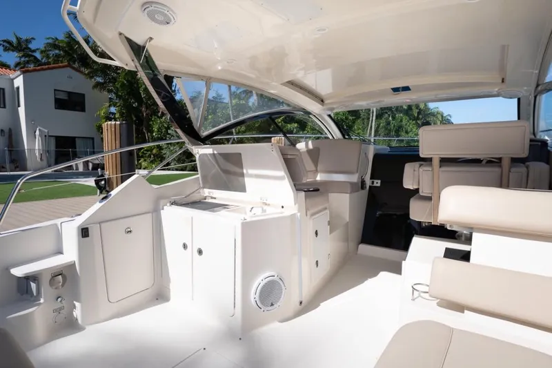  Yacht Photos Pics 2014 Pursuit SC 365i Sport Coupe interior with modern seating and sleek design.