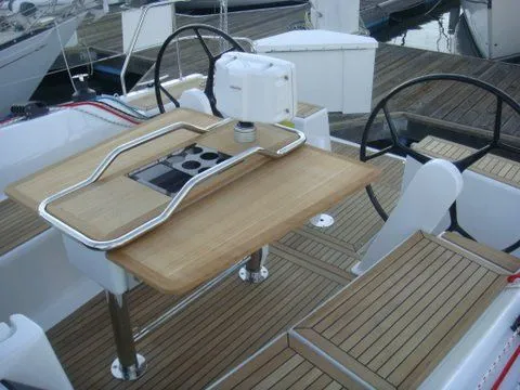 Bonejour Yacht Photos Pics Hanse 385 yacht cockpit with wooden table and dual steering wheels, 2012 model.