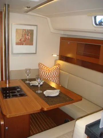 Bonejour Yacht Photos Pics Interior of 2012 Hanse 385 yacht with dining area and modern decor.
