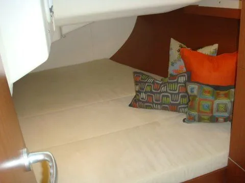 Bonejour Yacht Photos Pics Cozy cabin interior of 2012 Hanse 385 yacht with colorful pillows.