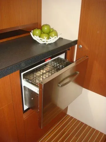 Bonejour Yacht Photos Pics Hanse 385 yacht kitchen with open dishwasher and fruit bowl, 2012 model.