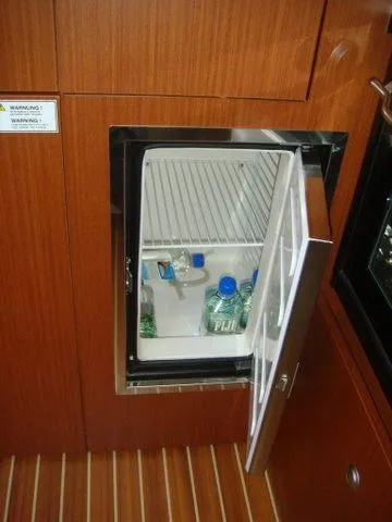 Bonejour Yacht Photos Pics Open mini fridge with bottled water inside on a 2012 Hanse 385 yacht.