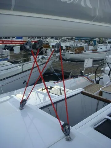 Bonejour Yacht Photos Pics Hanse 385 sailboat, 2012 model, featuring red rigging and deck details at a marina.