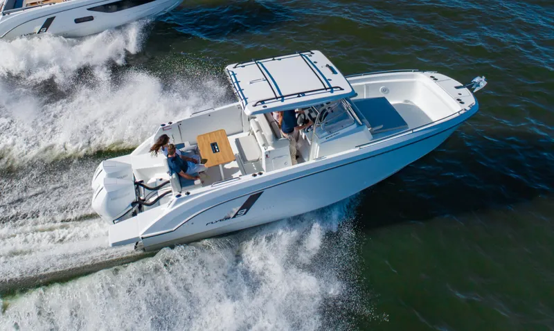  Yacht Photos Pics 2025 Beneteau Flyer 9 SPACEdeck cruising on open water, showcasing sleek design and performance.