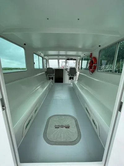  Yacht Photos Pics 2015 Wesmac Sport Fish interior with spacious seating and large windows.