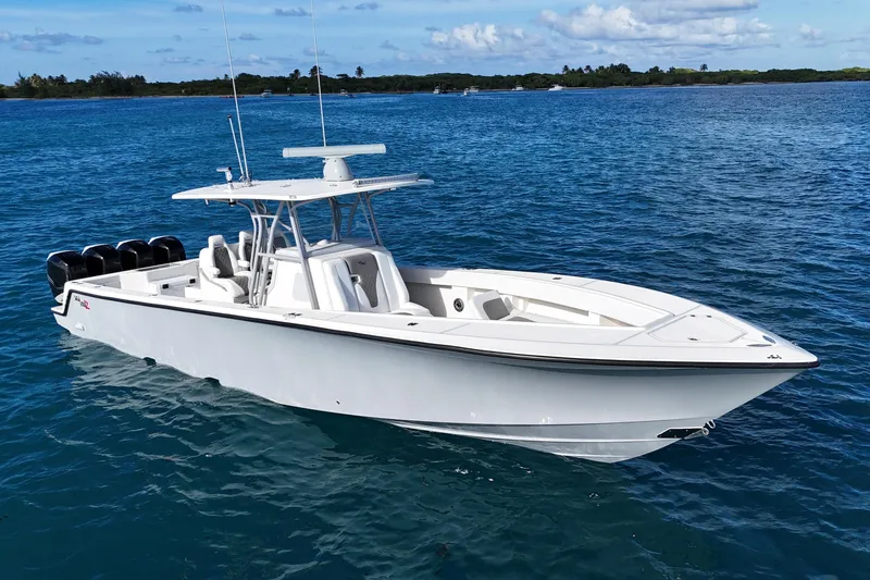  Yacht Photos Pics 2020 SeaVee 390Z boat on calm blue water, featuring sleek design and multiple engines.