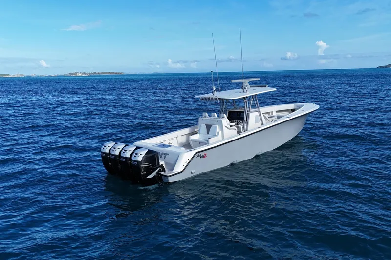  Yacht Photos Pics 2020 SeaVee 390Z boat with four engines on open ocean under clear blue sky.