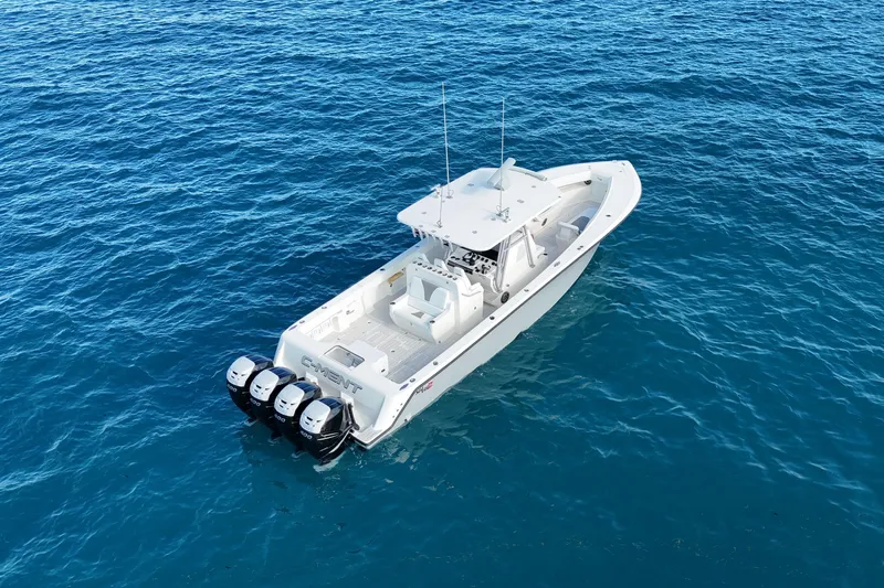  Yacht Photos Pics 2020 SeaVee 390Z boat with four engines on open blue water.