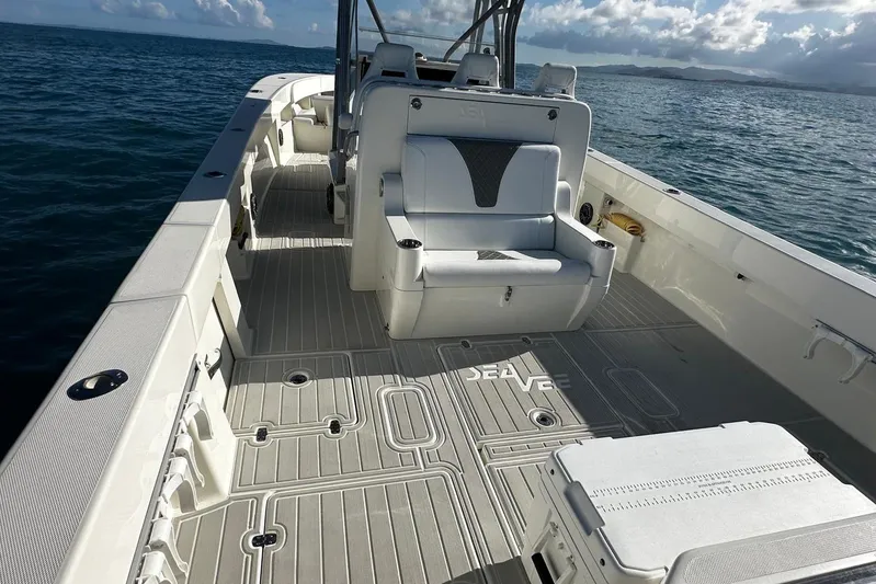  Yacht Photos Pics 2020 SeaVee 390Z boat interior with seating and open deck on the ocean.