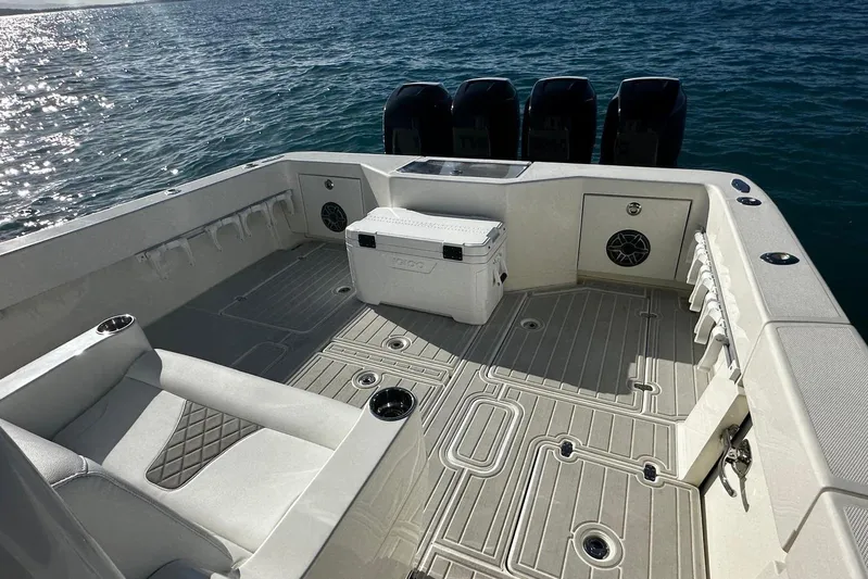  Yacht Photos Pics 2020 SeaVee 390Z boat deck with seating, cooler, and ocean backdrop.