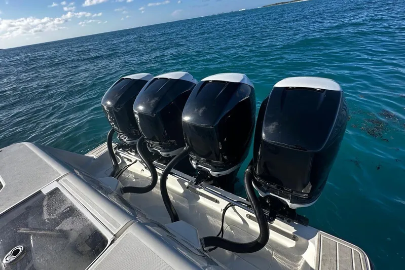  Yacht Photos Pics 2020 SeaVee 390Z boat with four powerful outboard engines on blue ocean water.