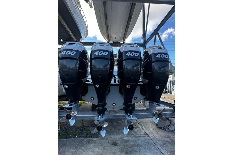  Yacht Photos Pics Four powerful outboard motors on a 2020 SeaVee 390Z boat, showcasing 400 horsepower each.