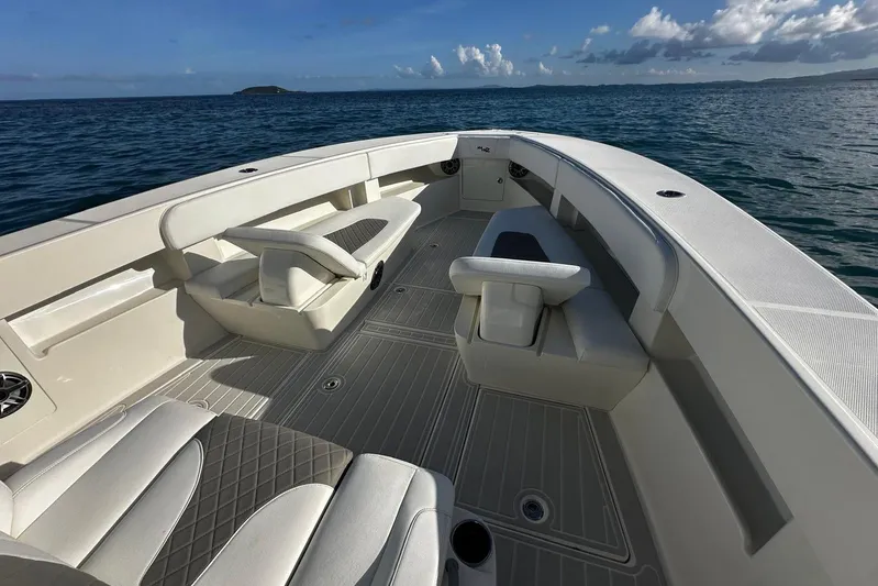  Yacht Photos Pics 2020 SeaVee 390Z boat interior with cushioned seating, on calm ocean waters.