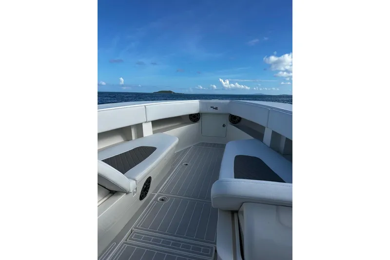  Yacht Photos Pics 2020 SeaVee 390Z boat interior with ocean view, featuring sleek seating and clear blue skies.