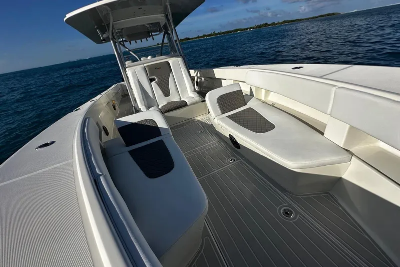  Yacht Photos Pics 2020 SeaVee 390Z boat interior with cushioned seating, on calm ocean waters.