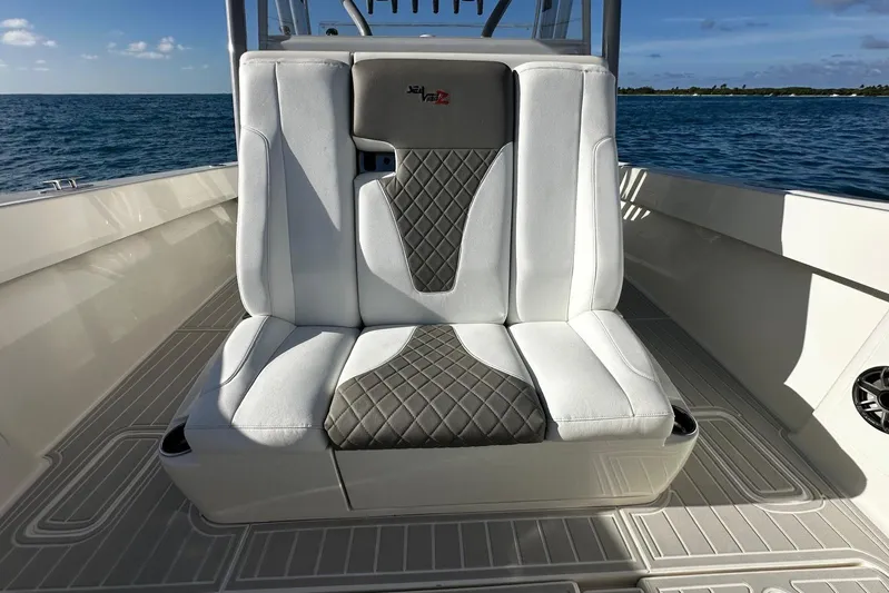  Yacht Photos Pics 2020 SeaVee 390Z boat seat with quilted design, ocean backdrop.
