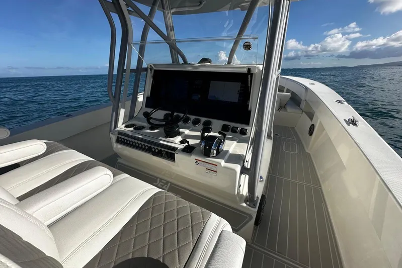 Yacht Photos Pics 2020 SeaVee 390Z boat interior with helm, ocean view, and clear sky.