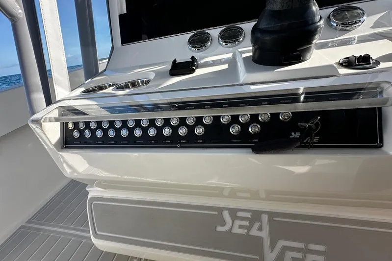  Yacht Photos Pics Control panel of a 2020 SeaVee 390Z boat with switches and gauges.