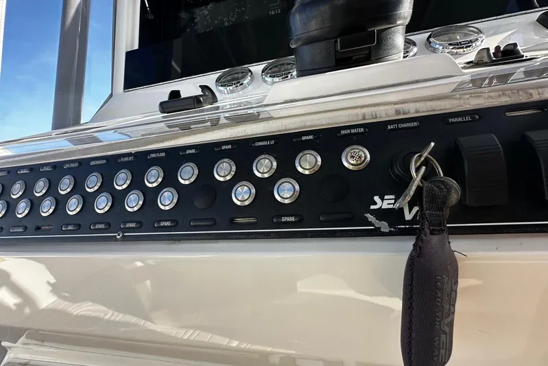 Yacht Photos Pics Control panel of a 2020 SeaVee 390Z boat with various switches and key.