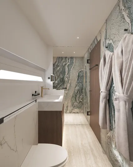 Laniakea Yacht Photos Pics Luxurious bathroom in 2026 Latitude 46 Catamaran with marble accents and modern fixtures.