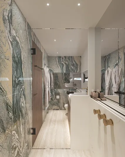 Laniakea Yacht Photos Pics Luxurious bathroom interior in 2026 Latitude 46 Catamaran with marble walls and modern fixtures.