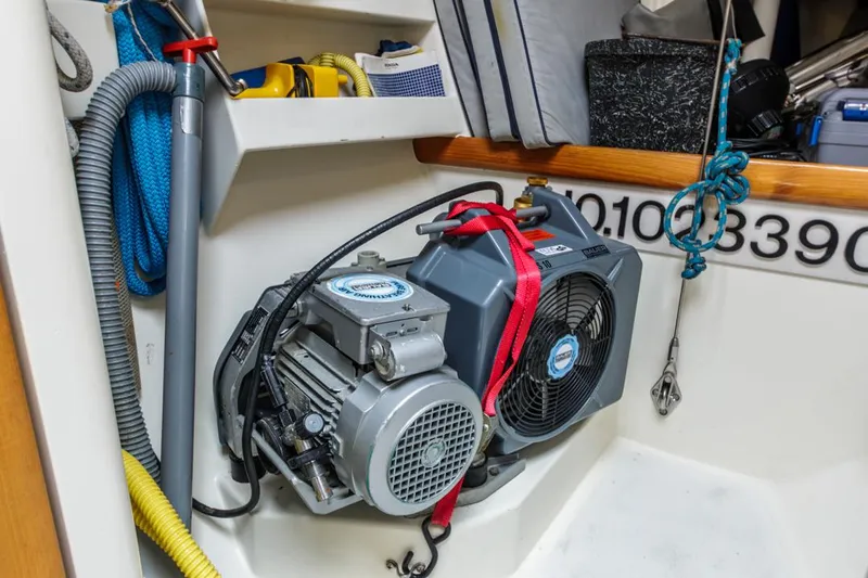 Jano Yacht Photos Pics Engine compartment of a 1994 Farr 55 yacht, featuring equipment and storage.