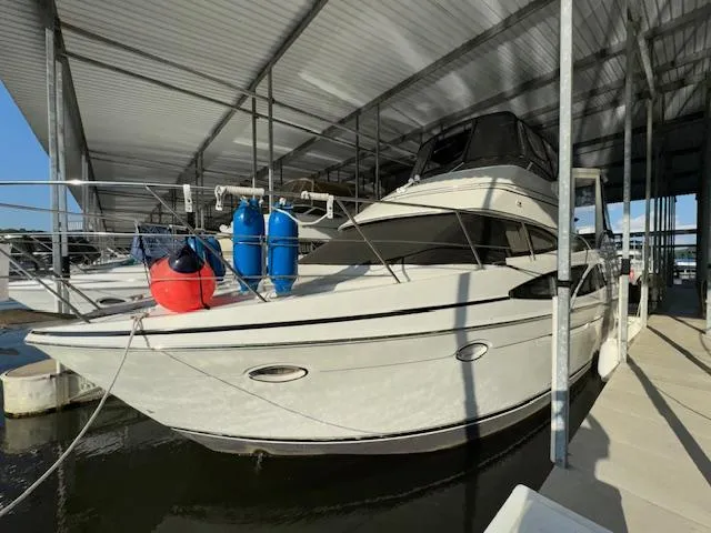 Diversion Yacht Photos Pics 2006 Carver 36 Motor Yacht docked under a covered marina.