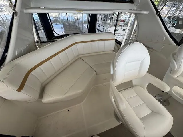Diversion Yacht Photos Pics 2006 Carver 36 Motor Yacht interior with white seating and panoramic windows.