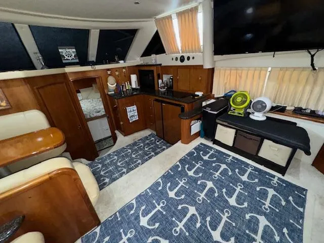 Diversion Yacht Photos Pics Interior of 2006 Carver 36 Motor Yacht with nautical-themed decor and wooden cabinetry.