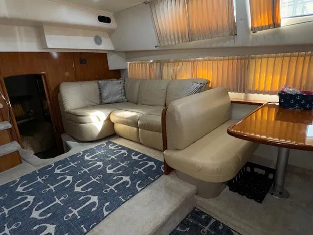 Diversion Yacht Photos Pics Interior of 2006 Carver 36 Motor Yacht with beige seating and nautical-themed decor.