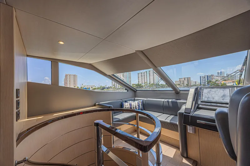 Dirty Dawg Yacht Photos Pics Interior of 2017 Sunseeker 75 Yacht with modern seating and cityscape view.