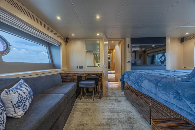 Dirty Dawg Yacht Photos Pics Luxurious interior of 2017 Sunseeker 75 Yacht with elegant bedroom and seating area.