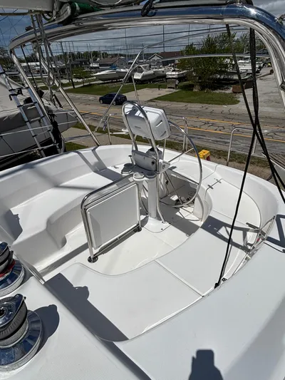 Memories Yacht Photos Pics 2004 Hunter 466 sailboat cockpit with steering wheel and winches, docked at marina.
