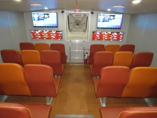Dream Star Yacht Photos Pics Interior of 1981 Midship Marine High Speed Passenger Ferry with seating and screens.