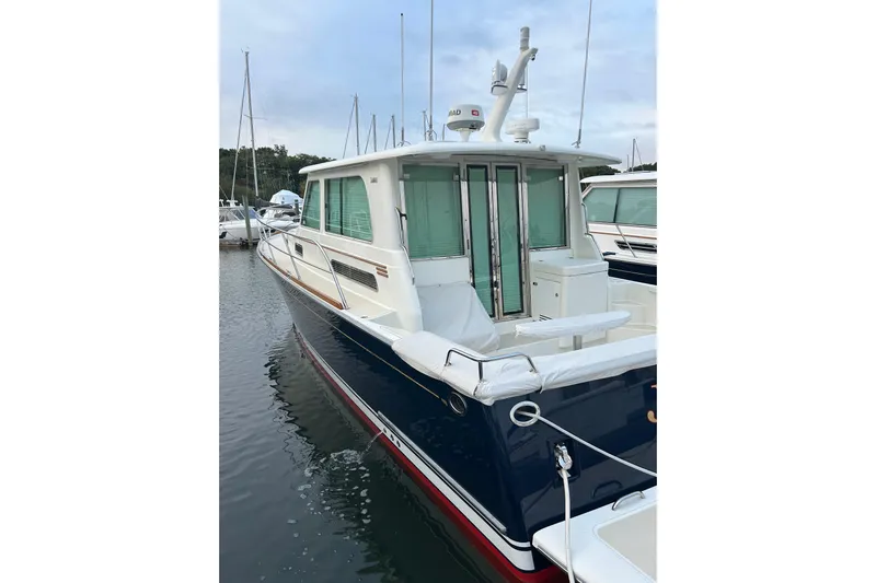  Yacht Photos Pics 2015 Sabre 42 Salon Express yacht docked in marina, featuring sleek design and modern amenities.