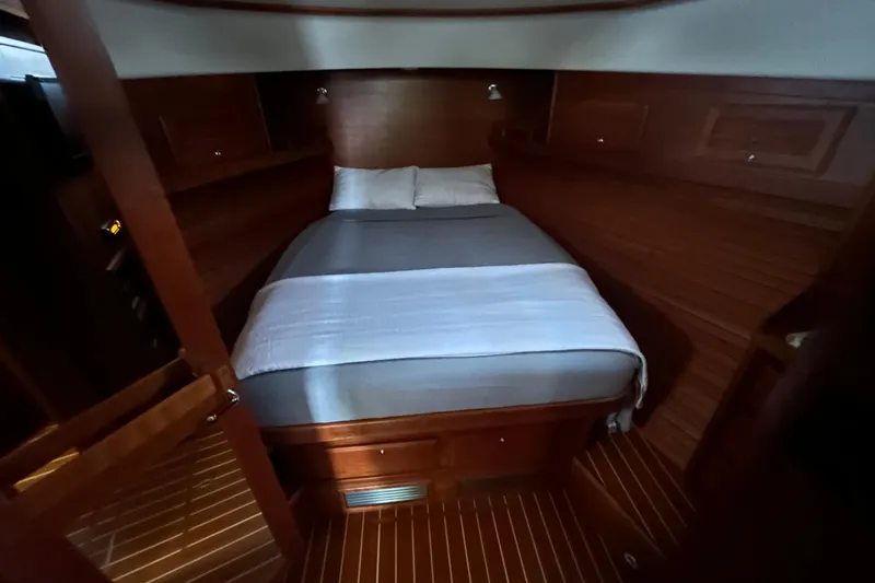  Yacht Photos Pics 2015 Sabre 42 Salon Express cabin with cozy bed and wooden interior.