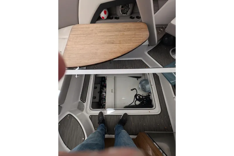  Yacht Photos Pics Interior view of 2018 Four Winns H350 boat with open hatch and wooden table.