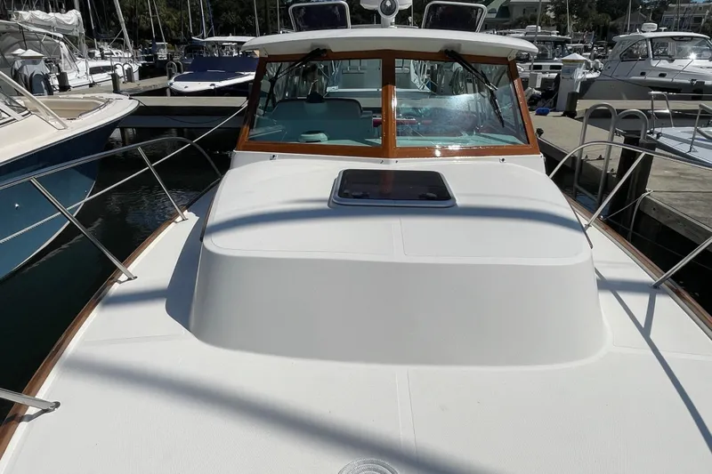 Beyond The Sea Yacht Photos Pics 2017 Hunt Surfhunter 29 boat docked at marina, showcasing sleek design and spacious deck.