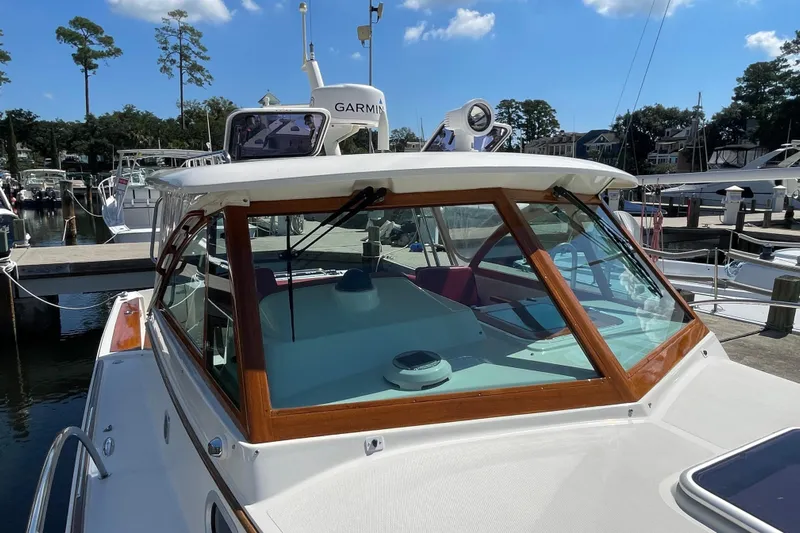 Beyond The Sea Yacht Photos Pics 2017 Hunt Surfhunter 29 boat docked at marina under clear blue sky.