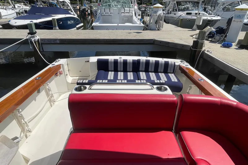 Beyond The Sea Yacht Photos Pics 2017 Hunt Surfhunter 29 boat interior with red and striped seating at marina.