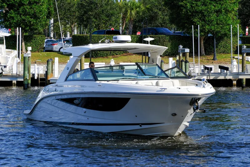 Sensei I Yacht Photos Pics 2021 Sea Ray SLX 400 luxury boat cruising near a marina.