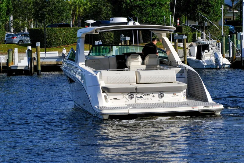 Sensei I Yacht Photos Pics 2021 Sea Ray SLX 400 luxury boat docked in a marina, rear view.
