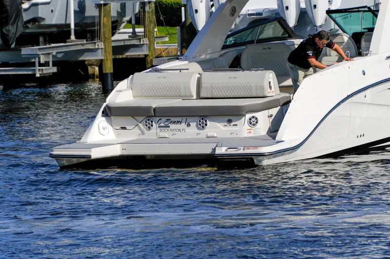 Sensei I Yacht Photos Pics 2021 Sea Ray SLX 400 boat docked, featuring spacious seating and sleek design.