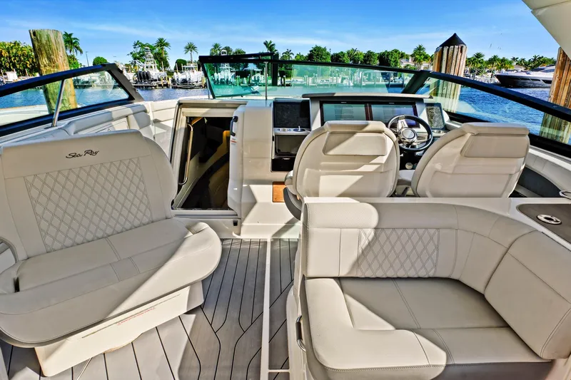 Sensei I Yacht Photos Pics Luxurious interior of 2021 Sea Ray SLX 400 boat with elegant seating and helm.