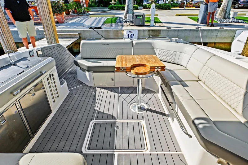 Sensei I Yacht Photos Pics Luxurious 2021 Sea Ray SLX 400 boat interior with elegant seating and wooden table.