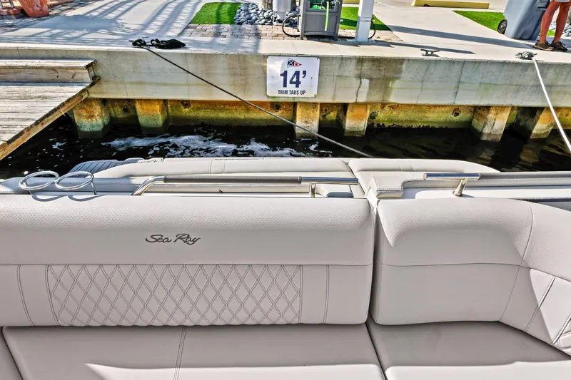 Sensei I Yacht Photos Pics 2021 Sea Ray SLX 400 boat interior with elegant seating at a marina dock.