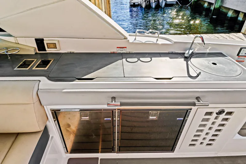 Sensei I Yacht Photos Pics Luxurious 2021 Sea Ray SLX 400 yacht kitchen with sleek countertop and modern amenities.