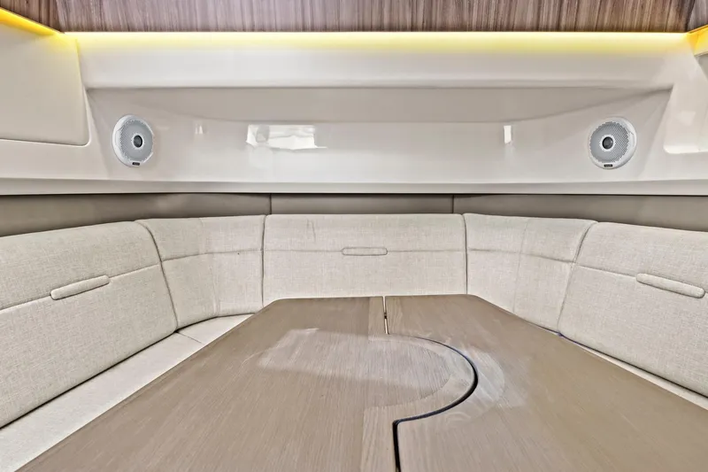 Sensei I Yacht Photos Pics Interior of 2021 Sea Ray SLX 400 boat with beige seating and wooden table.