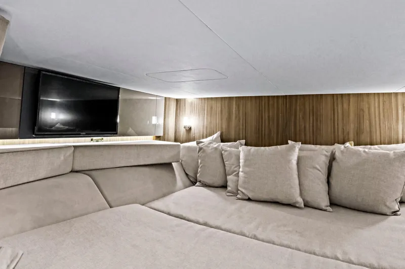 Sensei I Yacht Photos Pics Luxurious interior of 2021 Sea Ray SLX 400 yacht with cozy seating and TV.