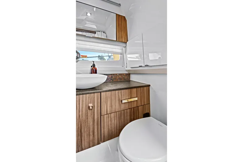 Sensei I Yacht Photos Pics Luxurious bathroom interior of 2021 Sea Ray SLX 400 yacht with modern fixtures.